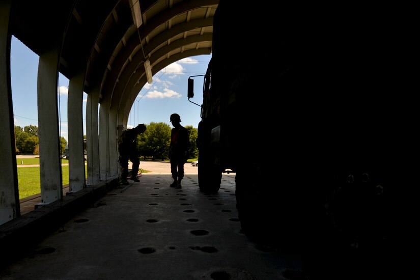 Maritime and Intermodal Training Department students leave Training Area 9 after completing an air movement exercise at Fort Eustis, Va., Aug. 22, 2016.  Cargo specialists are responsible for transferring or supervising the transfer of passengers, cargo and equipment to and from air, land and water. (U.S. Air Force photo by Staff Sgt. Natasha Stannard)