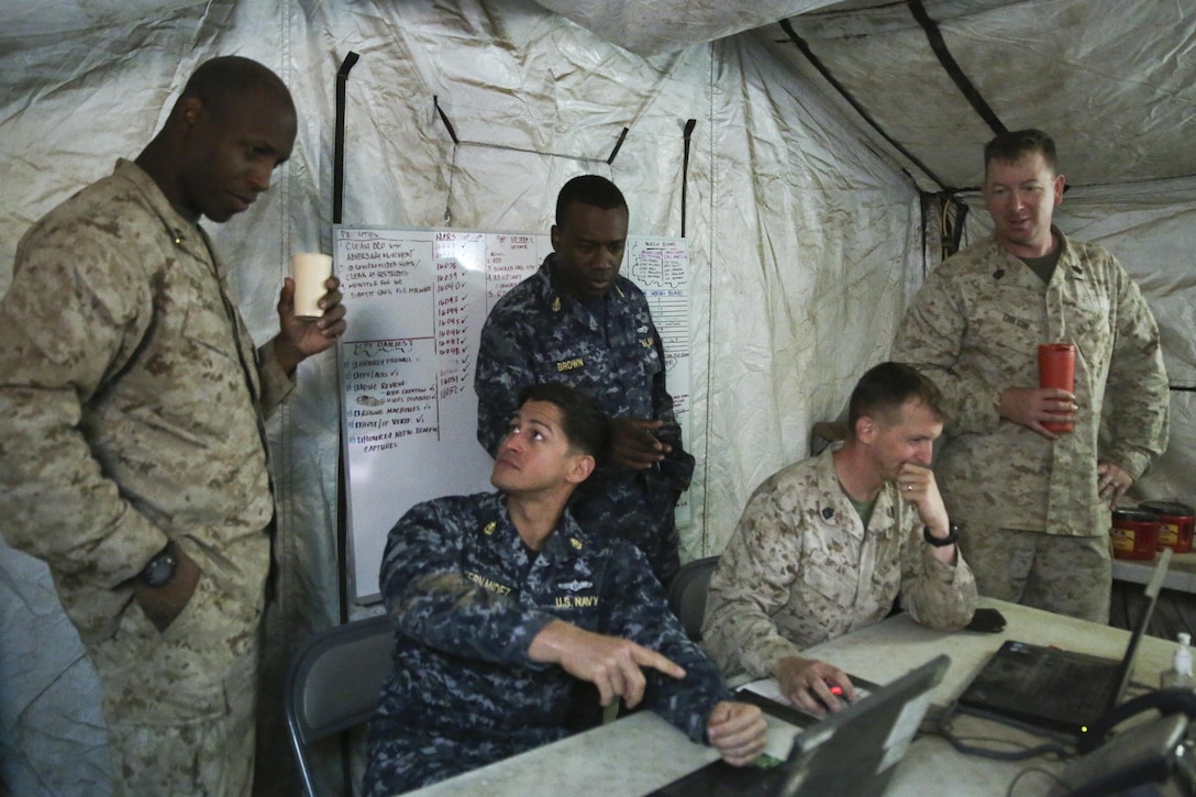 Marines with I Marine Expeditionary Force and sailors with 553 Cyber Protection Team, monitor network activity during I MEF Large Scale Exercise 2016 (LSE-16) at Marine Corps Air Station Miramar, Calif., Aug 22, 2016. The overall purpose of the exercise was to practice the deployment of a fighting force of more than 50,000 military personnel to a partner nation and incorporate both live-fire and simulated combat scenarios against a near-peer enemy force. 553-CPT is a team of cyber defense specialists with Fleet Cyber Command. The team advised I MEF while setting up the command element’s networks.