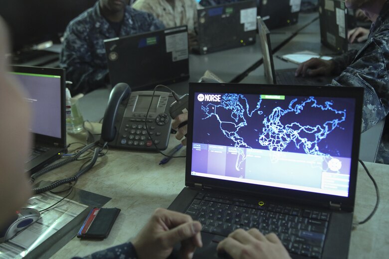 A sailor with 553 Cyber Protection Team opens a network monitoring program during I Marine Expeditionary Force Large Scale Exercise 2016 at Marine Corps Air Station Miramar, Calif., Aug 22, 2016. The overall purpose of the exercise was to practice the deployment of a fighting force of more than 50,000 military personnel to a partner nation and incorporate both live-fire and simulated combat scenarios against a near-peer enemy force. 553-CPT is a team of cyber defense specialists with Fleet Cyber Command. The team advised I MEF while setting up the command element’s networks.