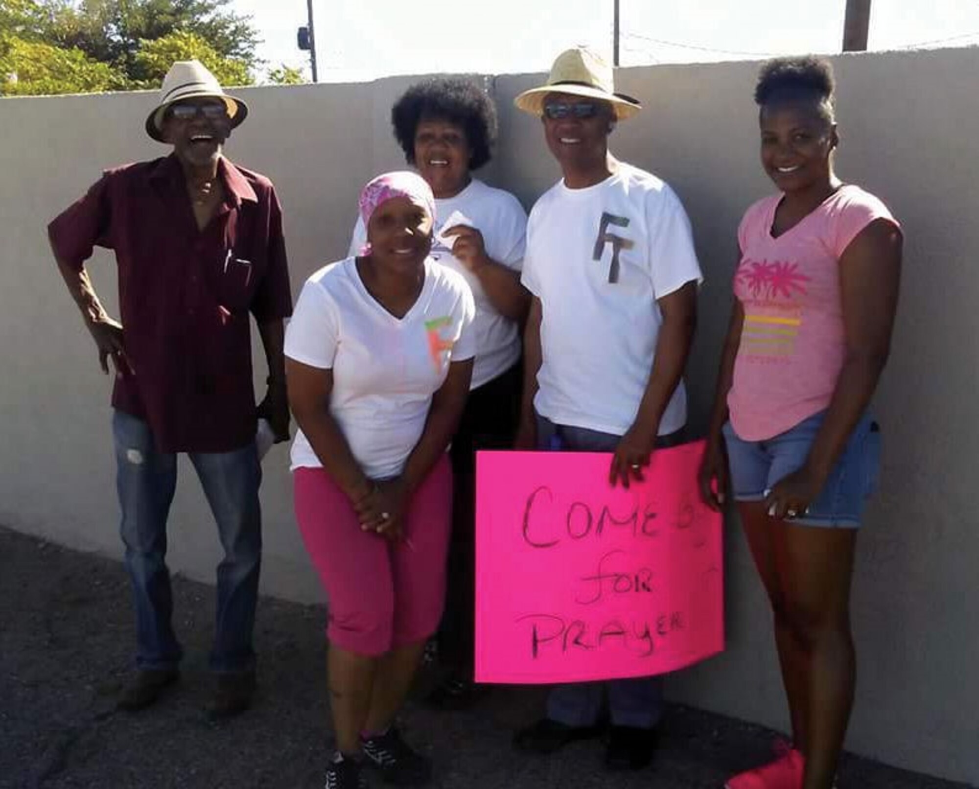 Help the Homeless Initiative-Feed the People volunteers gather for a group photo while distributing goods to homeless people. Staff Sgt. Natalie Dixon, far right, of the 150th Special Operations Wing, recently started working with the organization. (Courtesy photo)