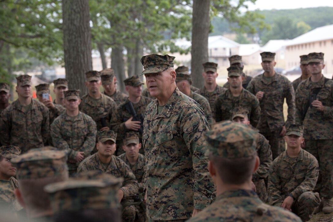 CAMP GRAYLING, Mich. – Gen. Robert B. Neller, Commandant of the Marine Corps, speaks with a group of Marines from Marine Forces Reserve about the importance of their training during Exercise Northern Strike 2016 at Camp Grayling Joint Maneuver Training Center, Mich., Aug. 17, 2016. The CMC visited exercise Northern Strike to observe the Marines and their training.  Exercise Northern Strike Northern Strike 16 is a National Guard Bureau-sponsored exercise uniting approximately 5,000 Army, Air Force, Marine, and Special Forces service members from 20 states and three coalition countries. The exercise strives to provide accessible, readiness-building opportunities for military units from all service branches to achieve and sustain proficiency in conducting mission command, air, sea, and ground maneuver integration, and the synchronization of fires in a joint, multinational, decisive action environment. (U.S. Marine Corps photo by Cpl. Devan Alonzo Barnett/Released)