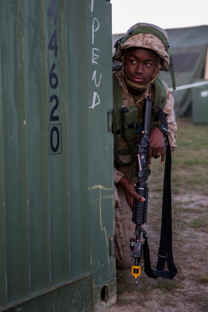 Petty Officer 3rd Class Ray Steward, hospital corpsman with 4th Medical Battalion, 4th Marine Logistics Group, Marine Forces Reserve, provides security for the Shock Trauma Platoon while a mock ambush occurred during Exercise Global Medic at Fort McCoy, Wisconsin, Aug. 17, 2016. Providing security was essential to accomplishing the mission as it ensured that the medical staff could safely administer health care to the patients. (U.S. Marine Corps photo by Lance Cpl. Melissa Martens/Released)