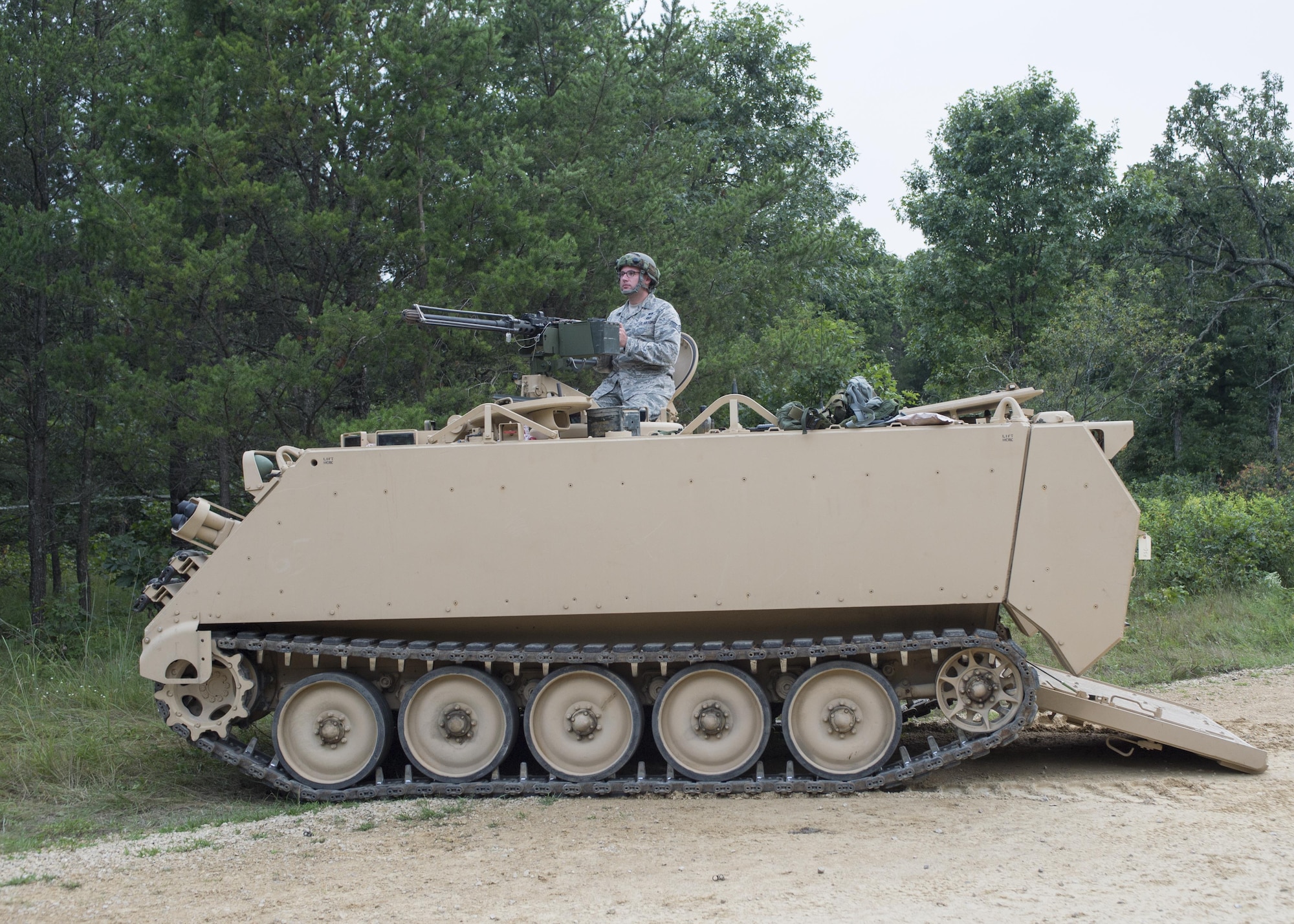 Staff Sgt. Ian King, 512th Civil Engineer Squadron emergency manager, provides security at an entry control point with a .50 caliber machine gun during exercise Patriot Warrior Aug. 15, 2016, Fort McCoy, Wis. King and fellow 512th CES Airmen embedded with the Army 340th Chemical Company during Patriot Warrior to share and learn interagency skills. (U.S. Air Force Photo/ Tech. Sgt. Nathan Rivard)