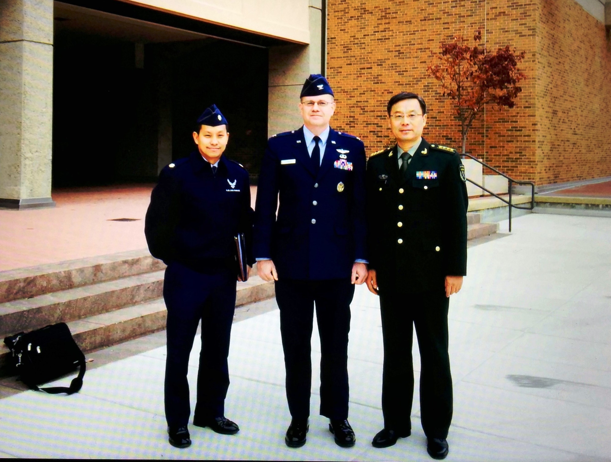 Col Alan Chambers (pictured center), former Director of AFMS International Health Specialist program, at an Acupuncture Exchange between the Department of Defense (DoD) and the People’s Liberation Army (PLA), Chinese military, at the Uniformed Services University (USU). On his left is Maj Andre Mach, IHS liaison, and on his right, a Senior Chinese Army official. (Bethesda, MD, December 2015.) Partnership exchanges like these are at the core of IHS program activities, sharing different approaches to medical practices and building relationships.
