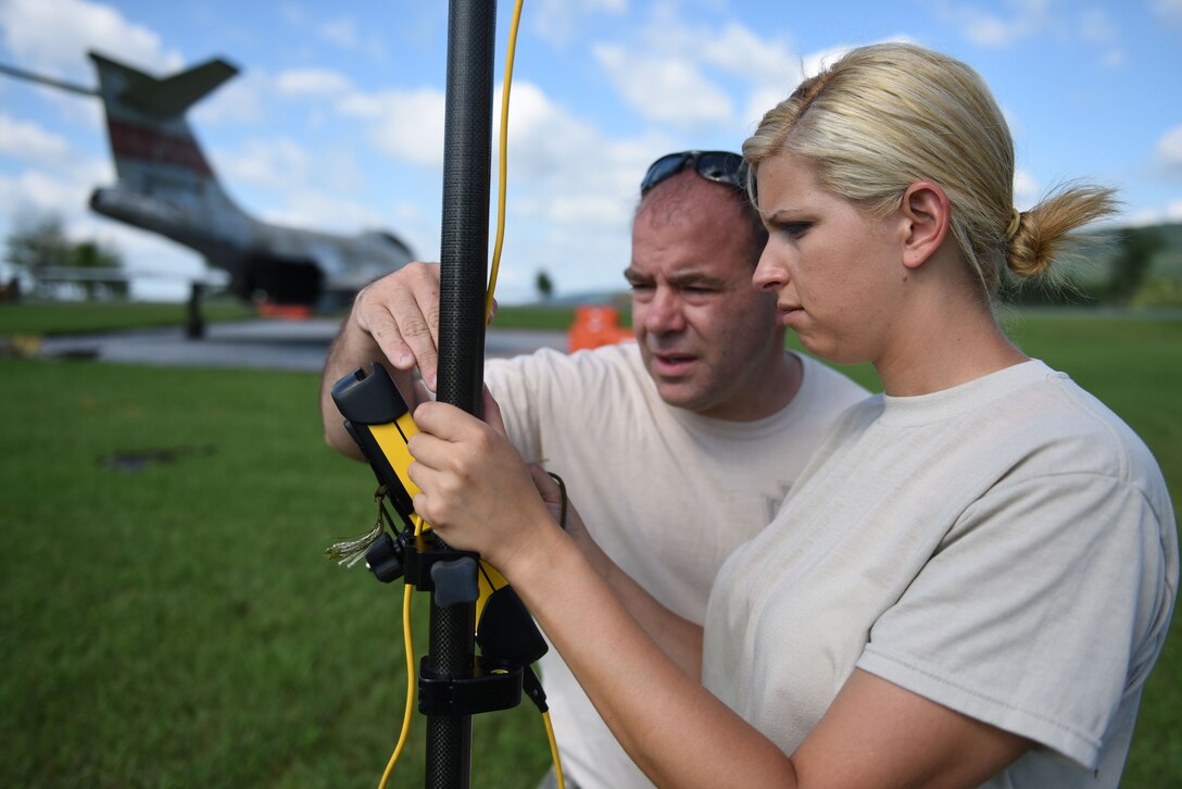 Staff Sgt. Lora Teets and Master Sgt. Brian Keenan, engineering assistants with the 911th Civil Engineer Squadron, survey an area during a training exercise with the 911th Civil Engineer Squadron at Fort Indiantown Gap, Pennsylvania, August 13-14, 2016. This was Teets’ first unit training assembly weekend with the 911th CES.