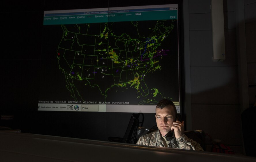 Tech. Sgt. James Sayres, a channel mission manager, checks the air schedule for the 618th Tanker Airlift Control Center at Scott Air Force Base, Ill., Aug. 1, 2016. Ongoing work by the Air Force and Army has filled training schedules by streamlining the Joint Airborne/Air Transportability Training program, an online system used by military units to request air support. (U.S. Air Force photo/Master Sgt. Brian Ferguson)