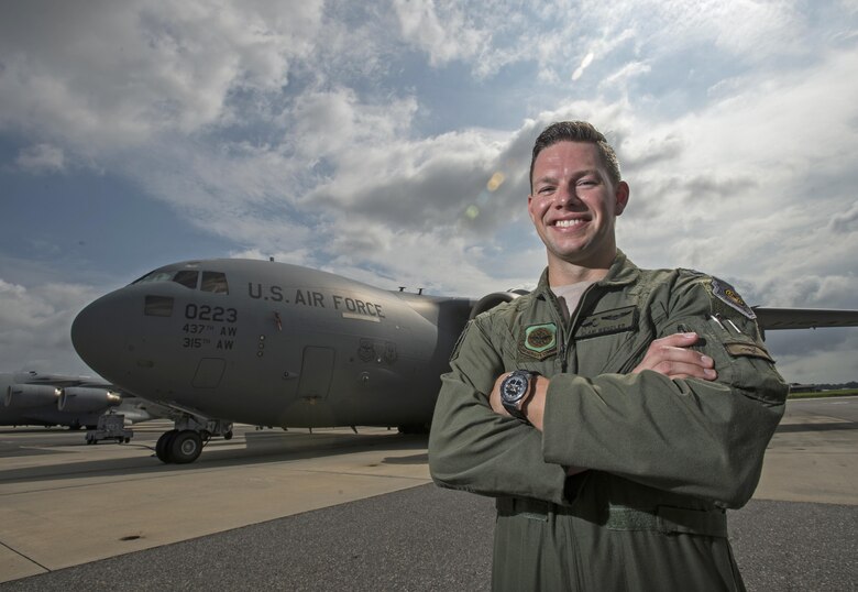 Capt. J.R. Wendell, a C-17 Globemaster III pilot, stands in front of a C-17 on the flightline at Joint Base Charleston, S.C., Aug. 3, 2016. Wendell both flew in and helped plan Swift Response 2016, a 10-nation training exercise that led to six C-17s airdropping hundreds of 82nd Airborne Division paratroopers overseas. (U.S. Air Force photo/Master Sgt. Brian Ferguson)