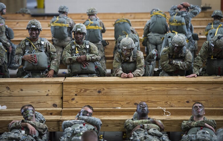 Soldiers from the 82nd Airborne Division wait to board a C-130 Hercules at Pope Army Airfield, Fort Bragg, N.C., Aug. 4, 2016. Ongoing work by the Air Force and Army has filled training schedules by streamlining the Joint Airborne/Air Transportability Training program, an online system used by military units to request air support. (U.S. Air Force photo/Master Sgt. Brian Ferguson)