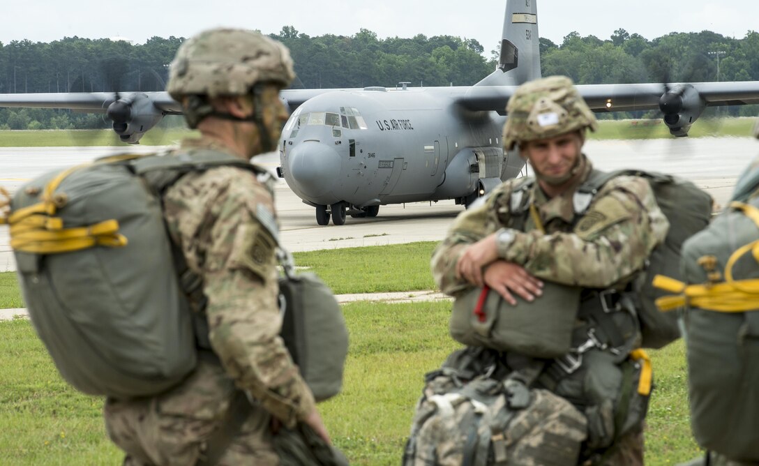 Soldiers from the 82nd Airborne Division wait to board a C-130 Hercules at Pope Army Airfield, Fort Bragg, N.C., Aug. 4, 2016. Ongoing work by the Air Force and Army has filled training schedules by streamlining the Joint Airborne/Air Transportability Training program, an online system used by military units to request air support. (U.S. Air Force photo/Master Sgt. Brian Ferguson)