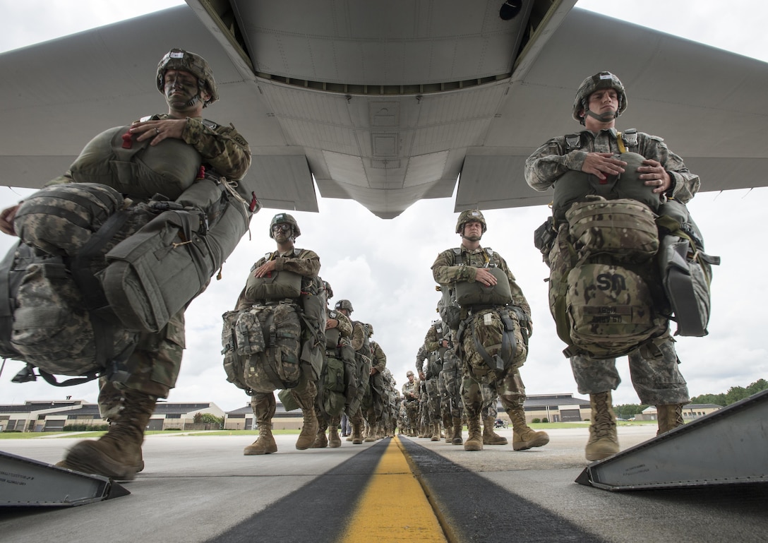 Soldiers from the 82nd Airborne Division board a C-130 Hercules at Pope Army Airfield, Fort Bragg, N.C., Aug. 4, 2016. Ongoing work by the Air Force and Army have filled training schedules by streamlining the Joint Airborne/Air Transportability Training program, an online system used by military units to request air support.(U.S. Air Force photo/Master Sgt. Brian Ferguson)