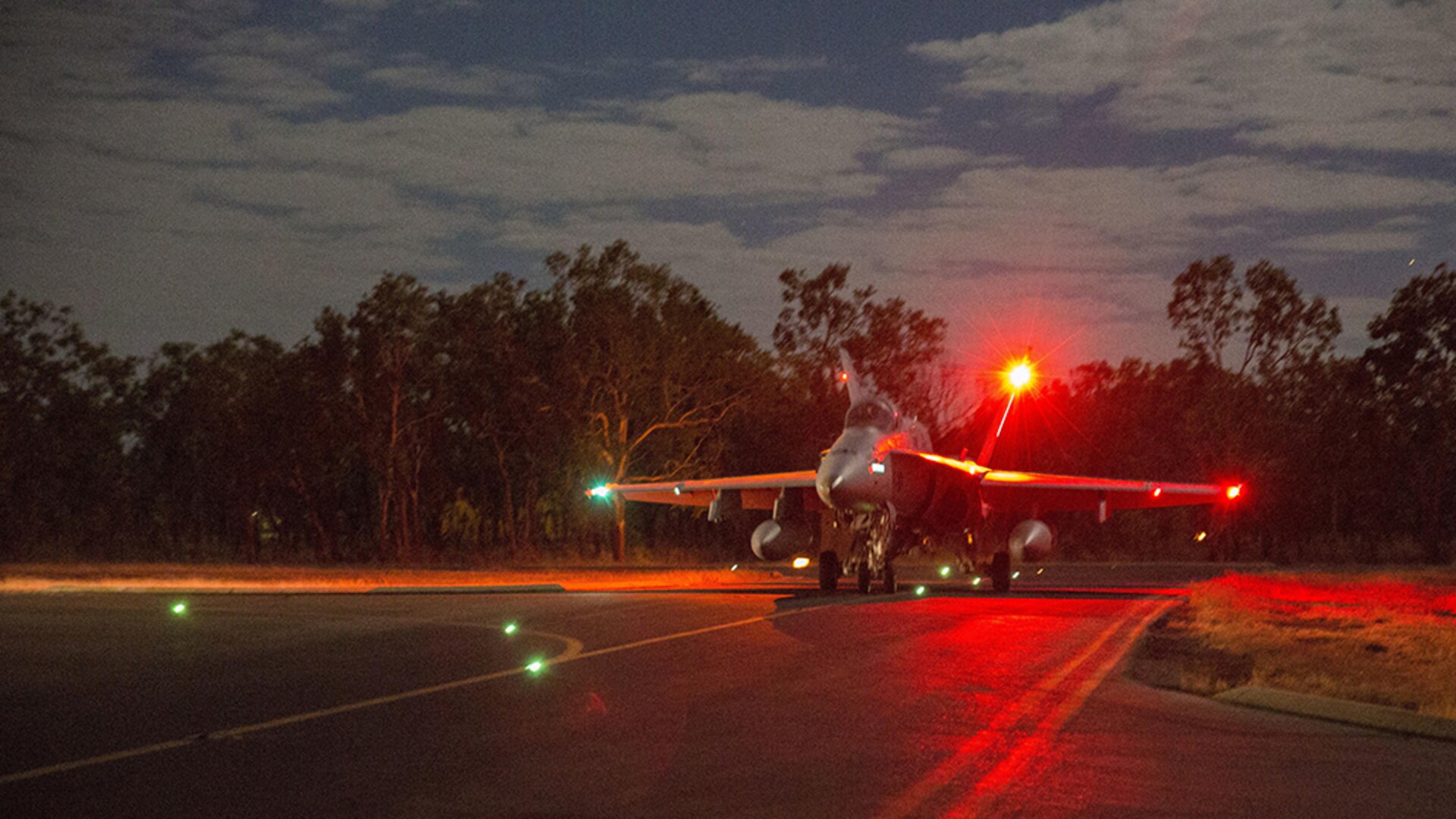 An F/A-18C Hornet assigned to Marine Fighter Attack Squadron (VMFA) 122 taxis to the runway for a night flight during Exercise Pitch Black 2016 at Royal Australian Air Force Base Tindal, Australia, Aug. 17, 2016. The flying squadron executed large force close air support, air interdiction, armed reconnaissance, and strike coordination and reconnaissance missions over the three week training evolution. The biennial, multinational exercise involves approximately 10 allied nations and prepares these forces for possible real-world scenarios. The bilateral effort amongst Exercise Pitch Black 2016 furthermore showcases the strength amongst various militaries and solidifies the relationship across the Pacific region. 
