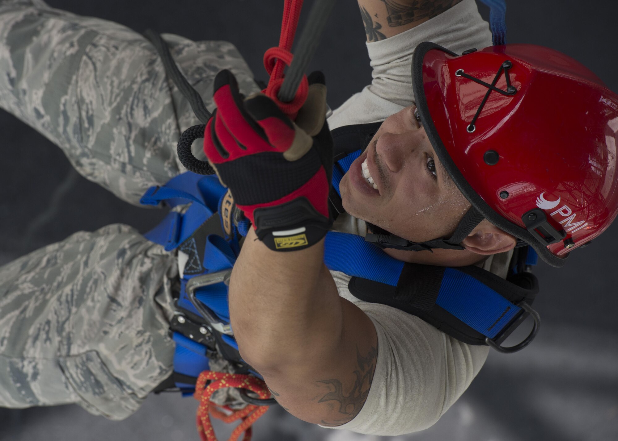 Staff Sgt. Julio Madera, 436th Civil Engineer Squadron fire inspector/crew chief, pulls himself up a rope during a Rescue Technician Course Aug. 18, 2016, at Dover Air Force Base, Del. This 18-day course includes classroom sessions and practical application. (U.S. Air Force photo by Senior Airman Zachary Cacicia)