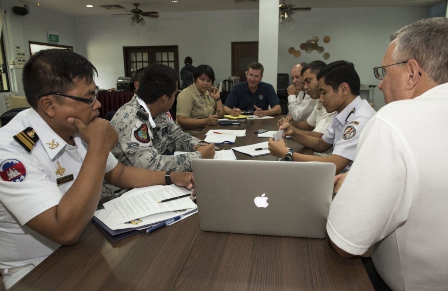 Liaison officers from participating countries of Southeast Asia Cooperation and Training (SEACAT) 2016 review a training brief to prepare for the exercise at Yankee Station, Aug. 19. SEACAT is multilateral exercise held annually with nine participating countries including the United States, Brunei, Indonesia, Malaysia, the Philippines, Cambodia, Bangladesh, Singapore, and Thailand.