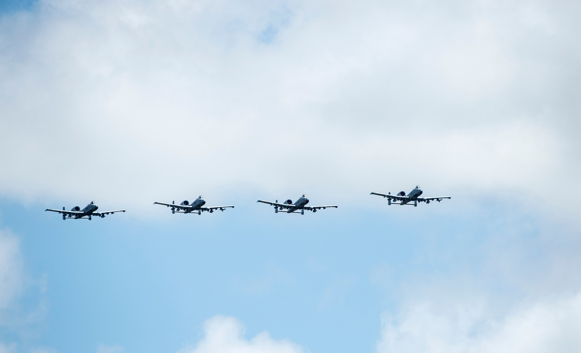 A formation of A-10C Thunderbolt IIs soar through the skies, Aug. 19, 2016, at Avon Park Air Force Range, Fla. The A-10C houses a GAU-8 cannon which is capable of firing 3,000 rounds per minute and can be used to defeat targets such as armored as tanks. (U.S. Air Force photo by Staff Sgt. Brian Valencia)