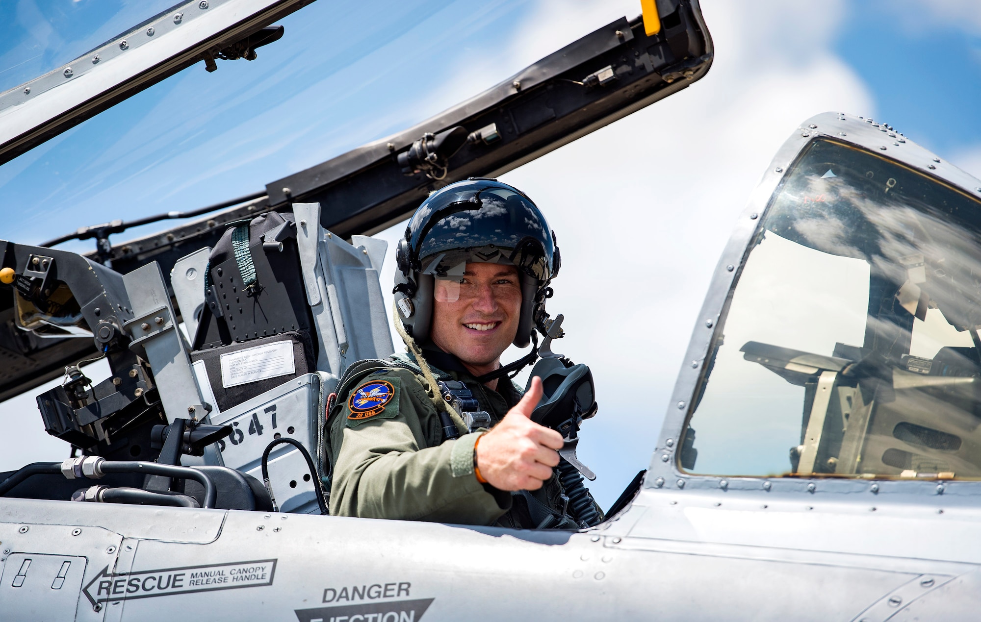U.S. Air Force Lt. Col. Dustin Ireland, 23d Operations Support Squadron commander, poses for a photo in an A-10C Thunderbolt II, before takeoff, Aug. 19, 2016, at Avon Park Air Force Range, Fla. The A-10C is used in close-air support missions and has the capability to loiter near battle areas for an extended period of time. (U.S. Air Force photo by Airman 1st Class Janiqua P. Robinson)