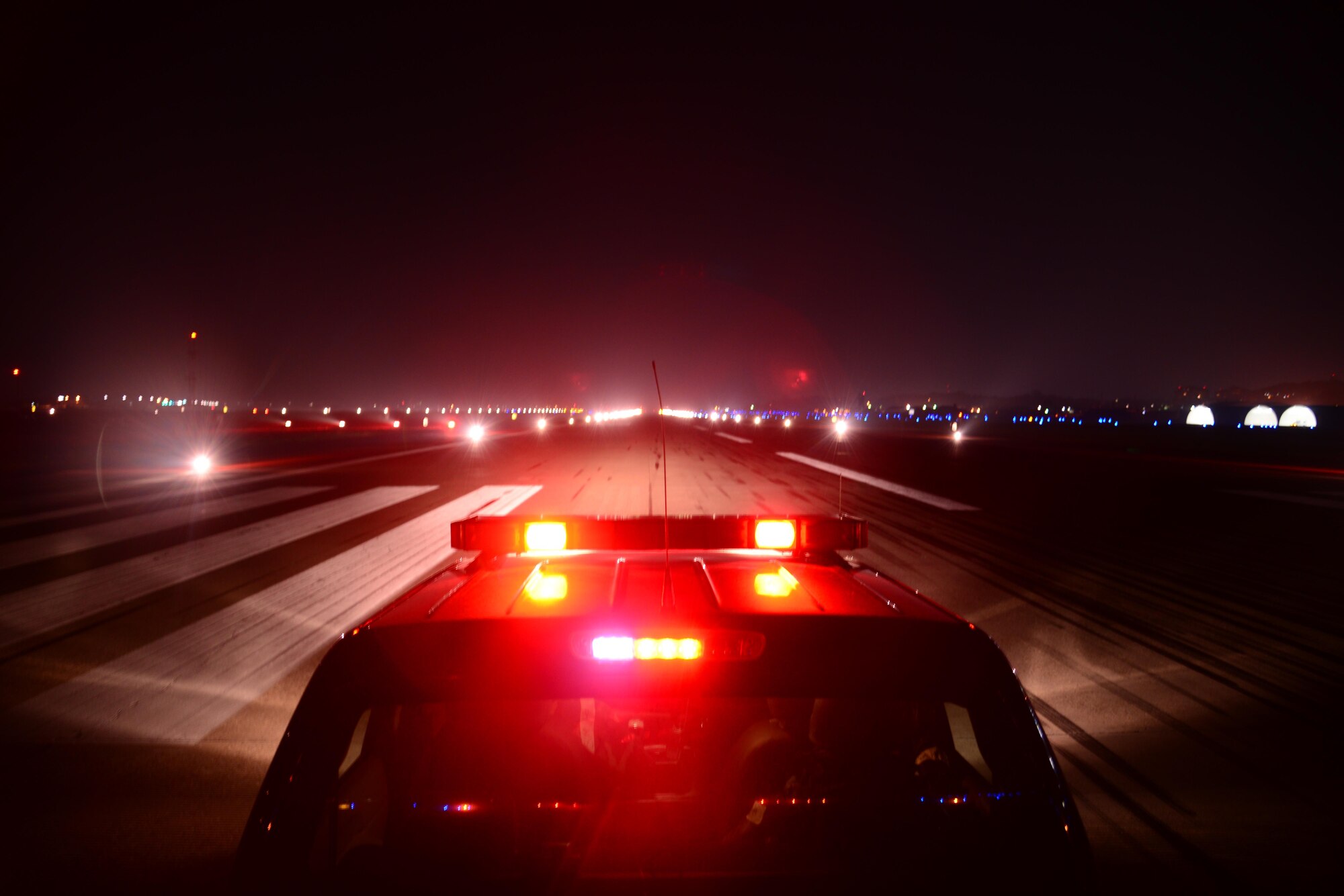Airmen from the 51st Operations Support Squadron airfield management operations flight conduct a check of the runway lights during Exercise Beverly Herd 16-2, Osan Air Base, Republic of Korea, Aug. 24, 2016. BH 16-2 is a week-long exercise that tests Osan team members’ abilities to accomplish their wartime missions. (U.S. Air Force Photo by Staff Sgt. Rachelle Coleman)