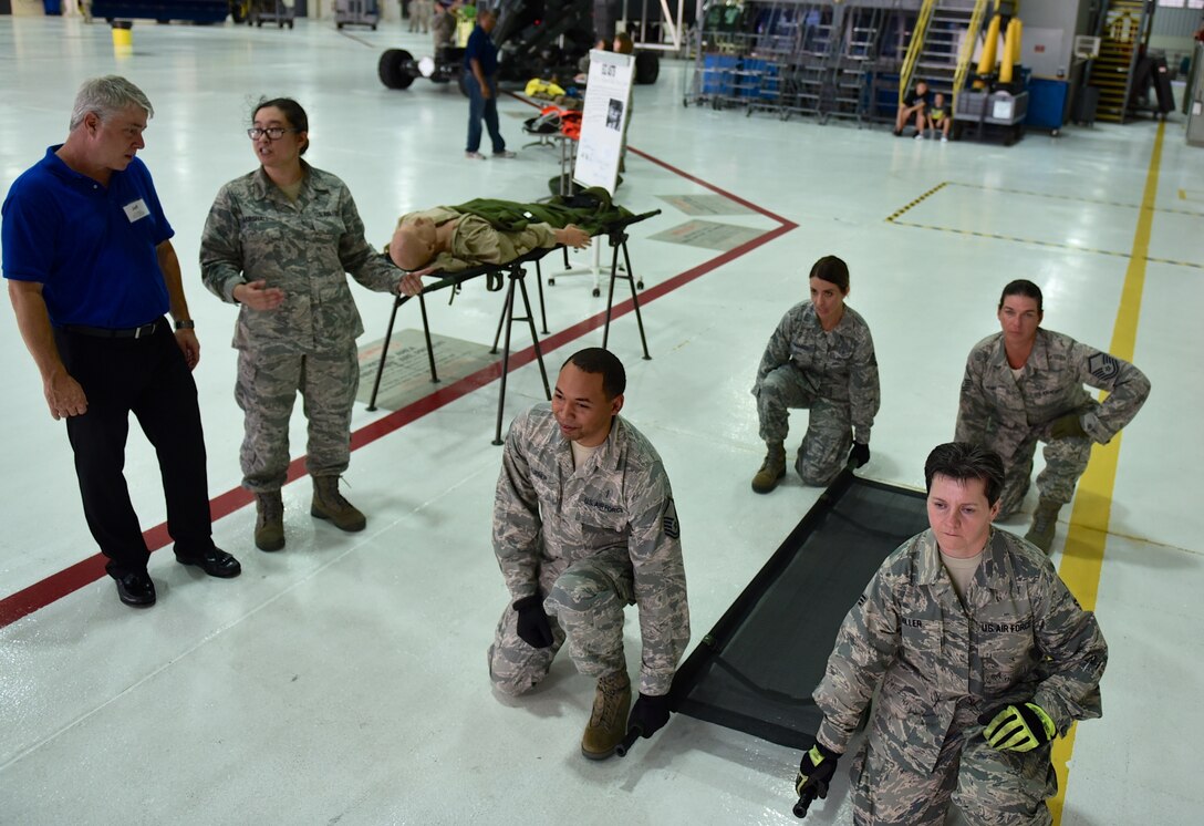 Senior Master Sgt. Laura Marshall along with other members of the 932nd Aeromedical Staging Squadron demonstrate proper patient liter carry techniques during the Belle-Scott event Aug. 18, 2016, Scott Air Force Base, Illinois.  (U.S. Air Force photo Christopher Parr) 