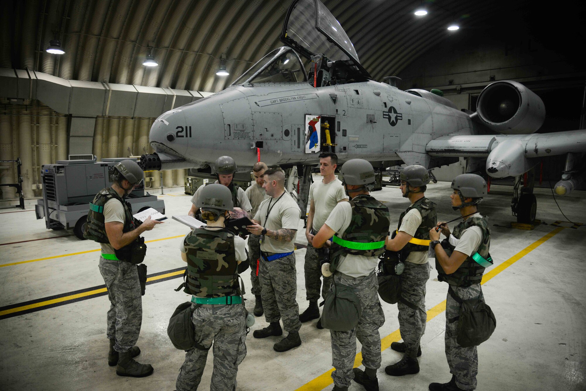 Airmen from the 51st Maintenance Group gather to discuss preflight inspections during Exercise Beverly Herd 16-2 at Osan Air Base, Republic of Korea. The 51st MXG maintain and inspect the A-10 Thunderbolt II aircraft, which provides close air support, air strike control and combat search and rescue capabilities to the 51st Fighter Wing in support of the defense of the ROK. (U.S. Air Force photo by Senior Airman Dillian Bamman)