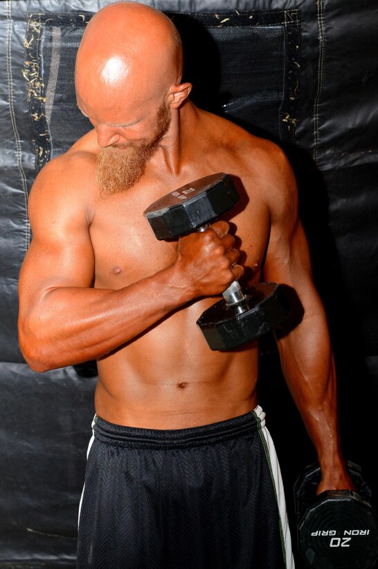 Shawn Barkhaus pumps up in preparation for the Bodybuilding, Bikini and Figure competition at Luke Air Force Base, Ariz., Aug. 20, 2016. Barkhaus took first place in his weight class and overall men’s bodybuilder during the competition. (U.S. Air Force photo by Senior Airman James Hensley)