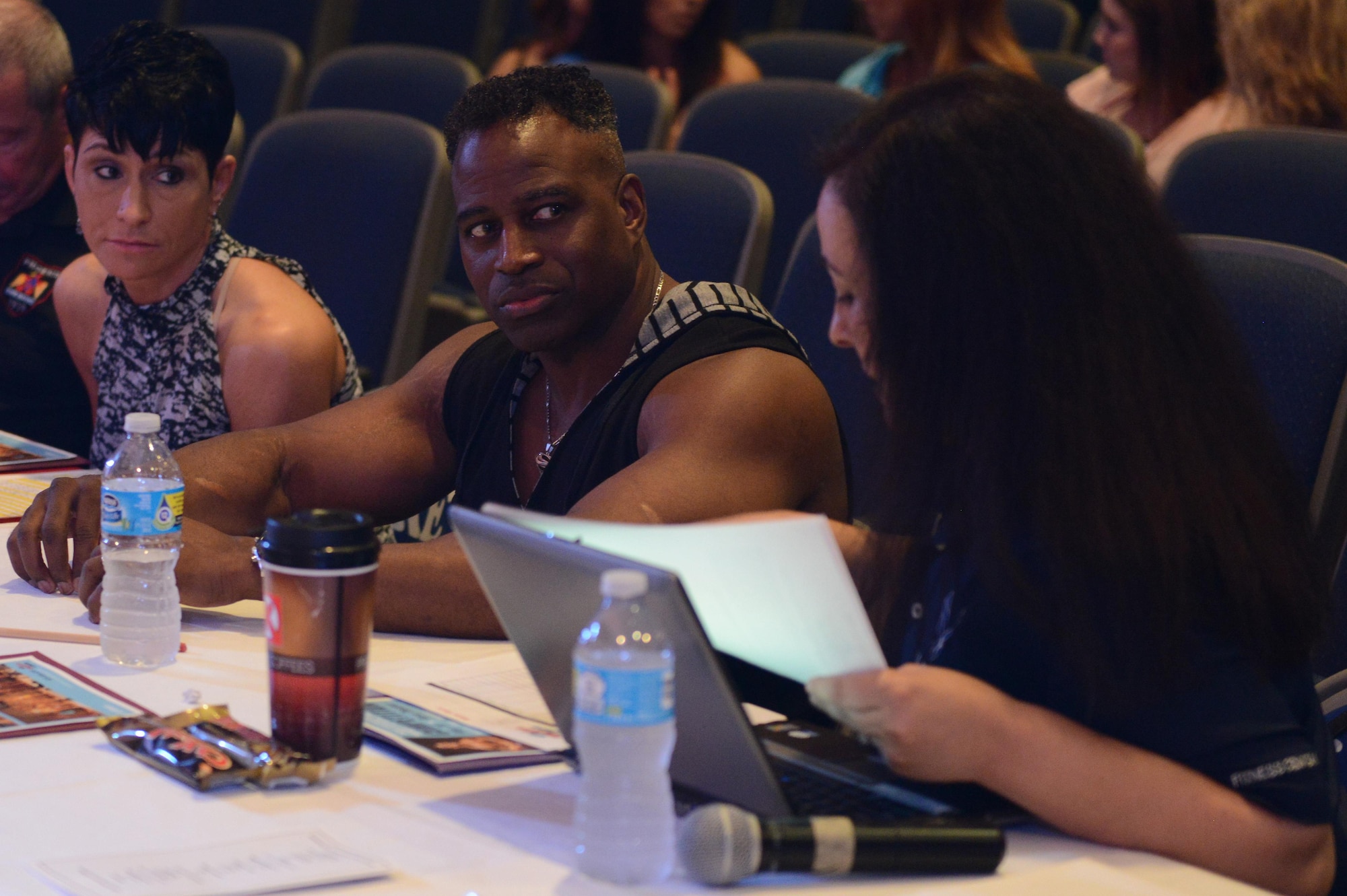 The judges of the Bodybuilding, Bikini and Figure competition deliberate on the performances of the competitors at Luke Air Force Base, Ariz., Aug. 20, 2016. The judges looked at appearances, poses and overall performance for each of the participants. (U.S. Air Force photo by Senior Airman James Hensley)