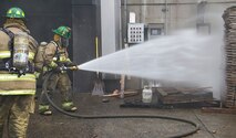 West Plains Academy trainees conduct basic firefighting skills during a course December 14, 2014. According to the Spokane County Fire District, 75 percent of its force is made up of volunteers. (Courtesy Photo)