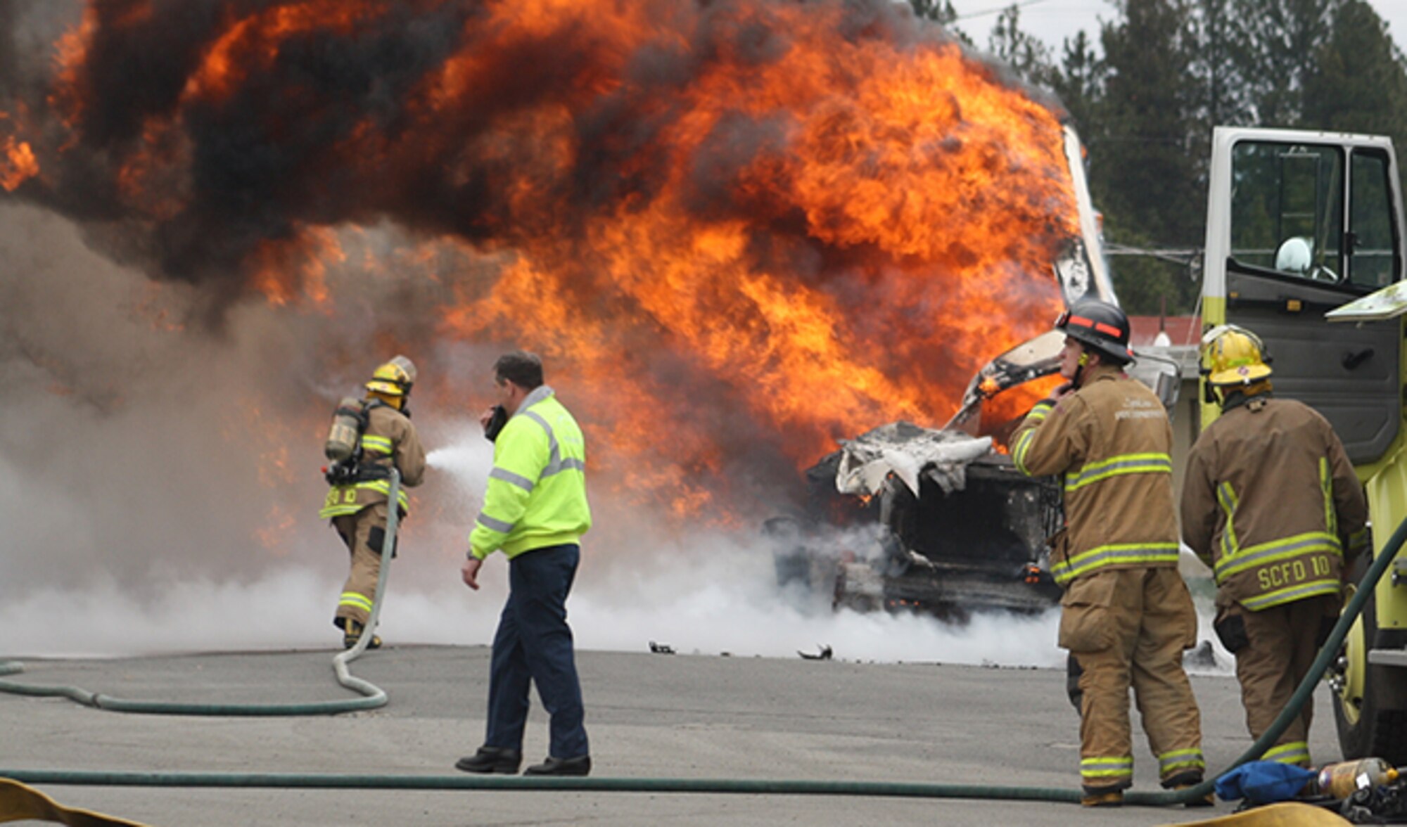 Volunteer firefighters with the Spokane County Fire District 10 participate in an exercise during a West Plains Academy course December 14, 2014. The West Plains Academy is a 12-week long program which arms new firefighters with the basic skills needed to be effective while not posing a risk to themselves or others. (Courtesy Photo)