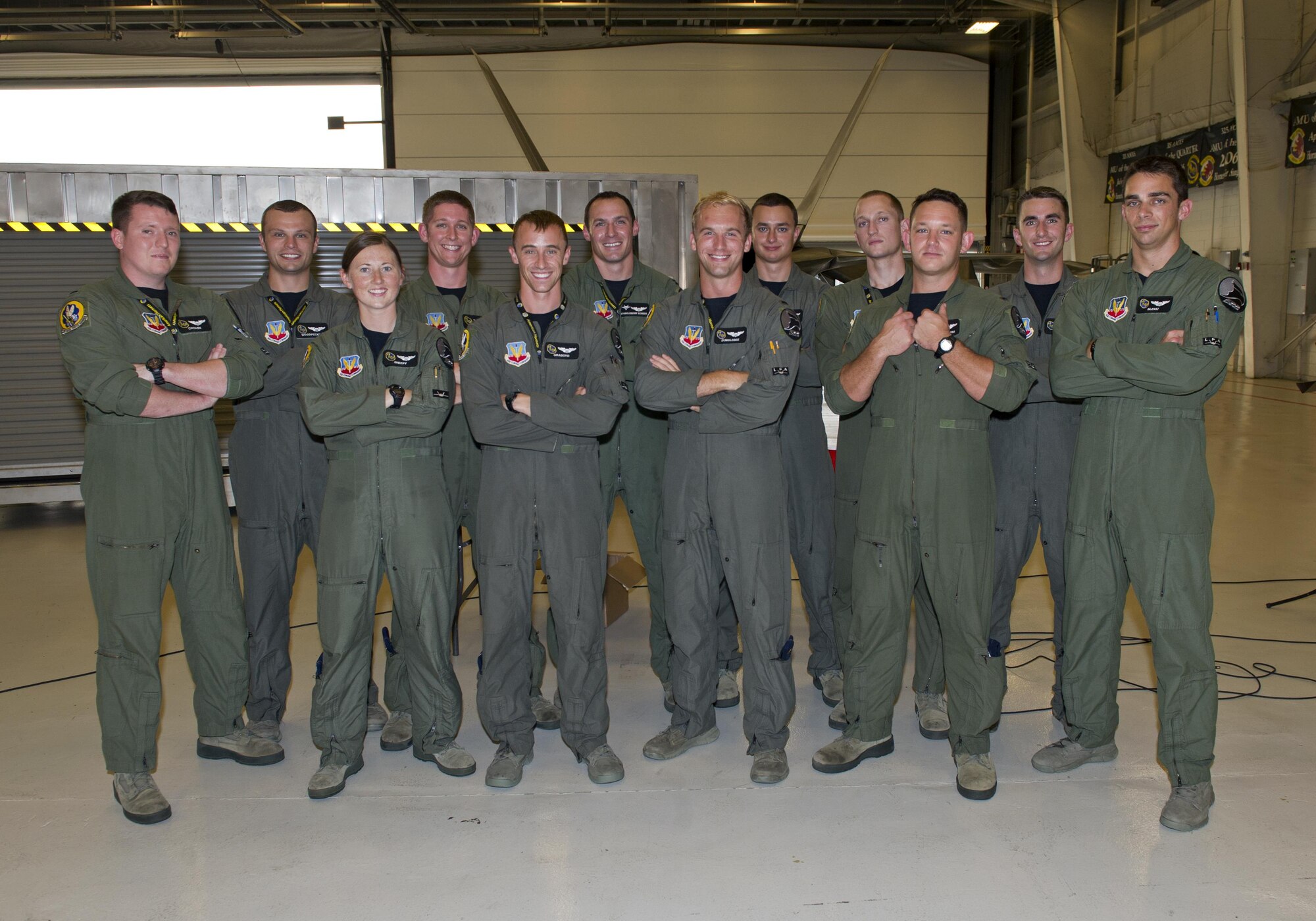 Tyndall’s F-22 Raptor Basic Course graduating class 16-ABR gathers in Hangar 5 after their graduation Aug. 19, 2016. Twelve students completed the seven-month-long course, making it the largest F-22 B-Course class in history. (U.S. Air Force photo by Staff Sgt. Alex Fox Echols III)