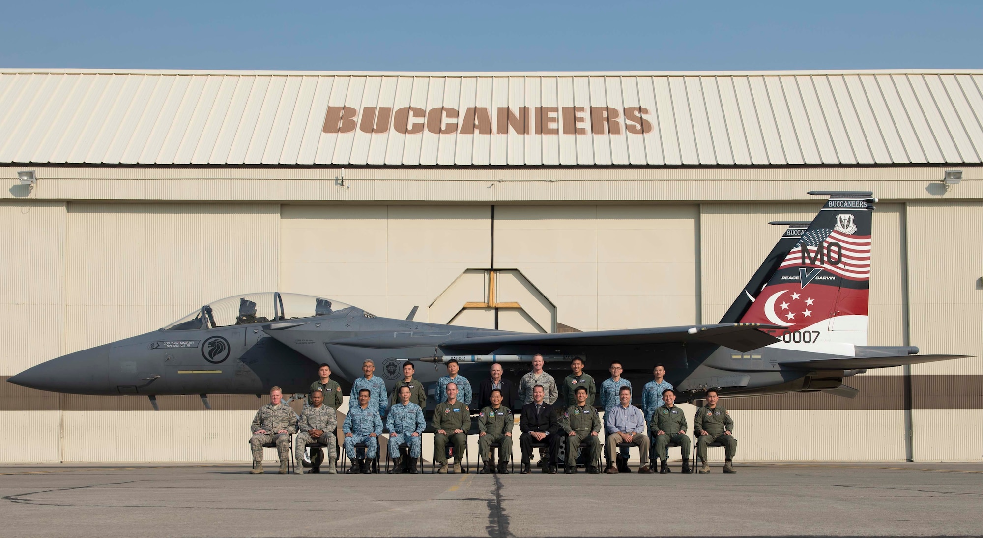 Republic of Singapore Air Force key leaders, 366th Fighter Wing leaders and local civic leaders pose for a photo Aug. 18, 2016, at Mountain Home Air Force Base, Idaho. The leaders attended the first-ever F-15SG Fighter Weapons Instructor Course graduation ceremony during their visit. (U.S. Air Force photo by Airman 1st Class Chester Mientkiewicz/Released)