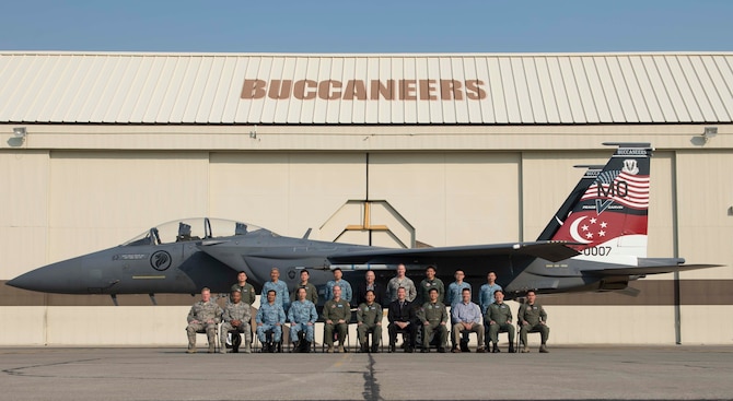 Republic of Singapore Air Force key leaders, 366th Fighter Wing leaders and local civic leaders pose for a photo Aug. 18, 2016, at Mountain Home Air Force Base, Idaho. The leaders attended the first-ever F-15SG Fighter Weapons Instructor Course graduation ceremony during their visit. (U.S. Air Force photo by Airman 1st Class Chester Mientkiewicz/Released)