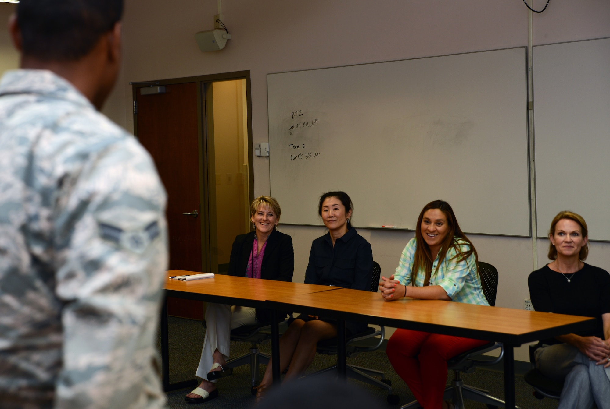 Airman Jean Gilles, 627 Logistic Readiness Squadron and First Term Airmen Center student speaks to Tammy Cox (left), spouse to Lt. Gen Sam Cox, 18th Air Force commander, during their visit to McChord Aug. 17, 2016, at Joint Base Lewis-McChord, Wash. Cox visited the FTAC to meet with Airmen and discuss what they do here. (U.S. Air Force photo/Senior Airman Jacob Jimenez)     