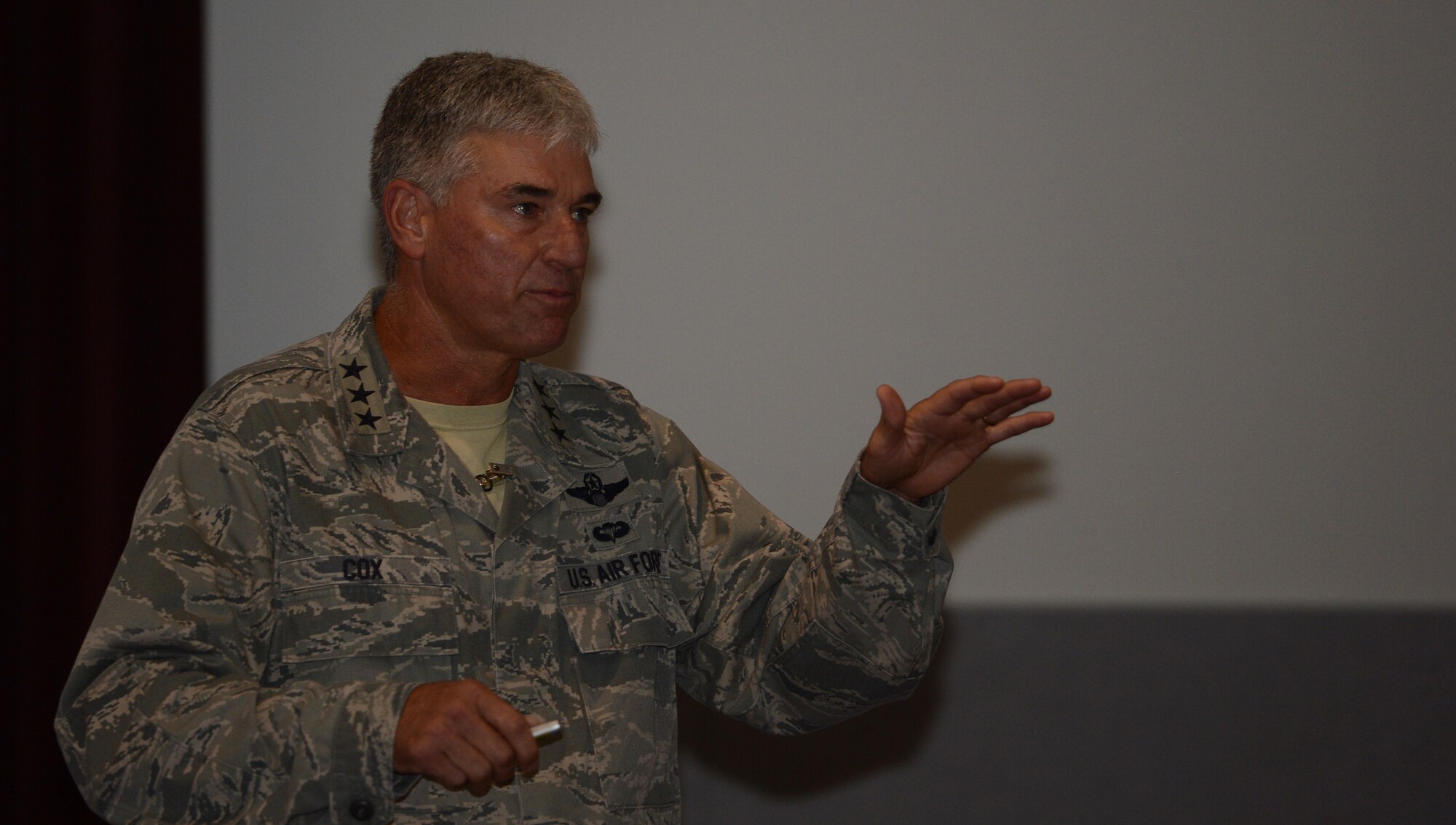 Lt. Gen. Sam Cox briefs Team McChord Airmen at an all call Aug. 19, 2016, at Joint Base Lewis-McChord, Wash. Cox spoke to Airmen about the importance of Team McChord’s global mission to sustain rapid global mobility through the individual contribution we each make as an Airman to the overall mission. (U.S. Air Force photo/Senior Airman Jacob Jimenez)     
