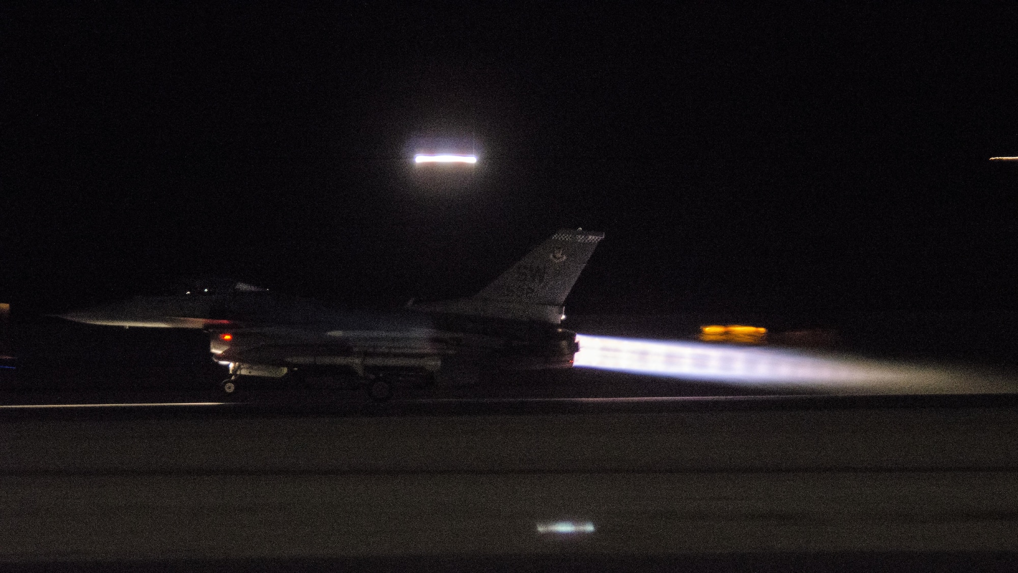 An F-16CM Fighting Falcon assigned to the 55th Fighter Squadron, Shaw Air Force Base, S.C., takes take off while conducting a night sortie during exercise Red Flag 16-4 at Nellis AFB, Nev., Aug. 17, 2016. The 55th FS flew two missions daily, a night and day sortie, in support of Red Flag 16-4 to provide suppression of enemy air defenses. (U. S. Air Force photo by Tech. Sgt. Frank Miller)