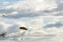Bundles dropped from a C-130 Hercules fall to the ground during Red Flag-Alaska at Joint Base Elmendorf-Richardson, Alaska, Aug. 16, 2016. Red Flag provides joint offensive counter-air, interdiction, close air support, and large force employment training in a simulated combat environment. (U.S. Air Force photo by Staff Sgt. Michael Smith/Released)