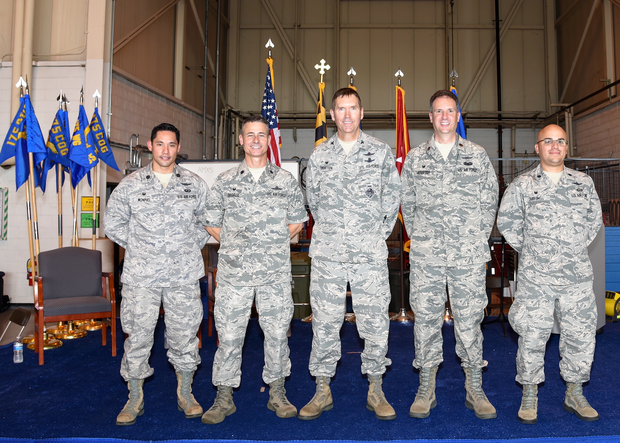Lt. Col. Andrew Wonpat, Col. Kevin B. George, Col. Shawn Bratton, Maj. Thomas Herster, and Lt. Col. Joed Carbonell (left to right) pose for a photo at the completion of the 175th Cyberspace Operations Group activation ceremony, August 21, 2016 at Warfield Air National Guard Base, Middle River, Md. The ceremony recognized the activation of the 175th COG, and three squadrons, 275th Cyberspace Operations Squadron, 275th Operations Support Squadron, and the 276th Cyberspace Operations Squadron along with the re-designation of the 175th Cyberspace Operations Squadron and the 135th Intelligence Squadron. (U.S Air National Guard Photo by Airman 1st Class Enjoli Saunders/RELEASED)