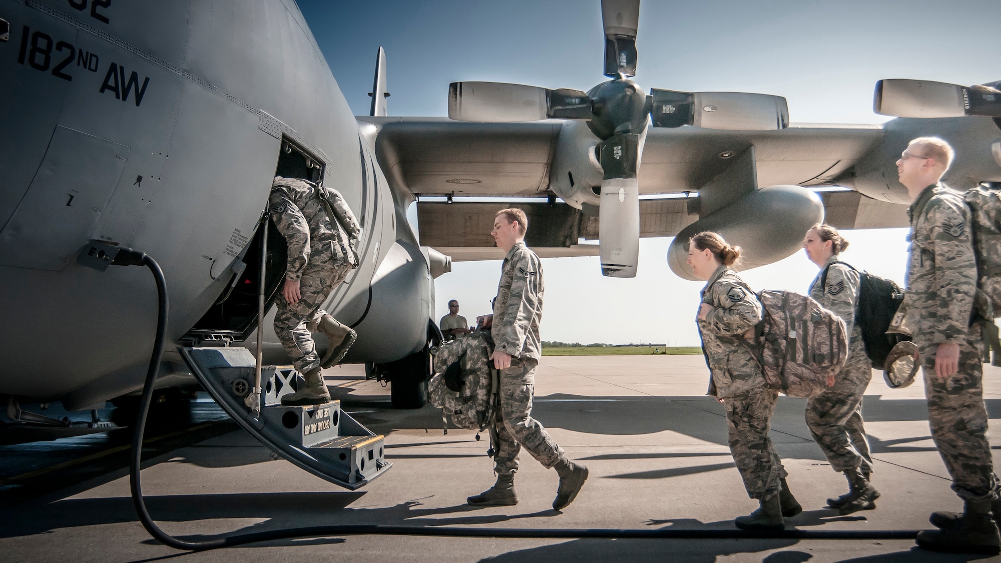 Airmen from the 168th Air Support Operations Squadron, Peoria, Ill., load into a C-130 Hercules from the 182nd Airlift Wing, Peoria, Ill., on July 17, 2015, at the 182nd Airlift Wing, Peoria, Ill., to be transported to Alpena Combat Readiness Training Center, Alpena, Michigan to participate in Exercise Northern Strike 2015. Exercise Northern Strike 2015 is a joint multi-national combined arms training exercise conducted in Michigan. (U.S. Air National Guard photo by Master Sgt. Scott Thompson/released)