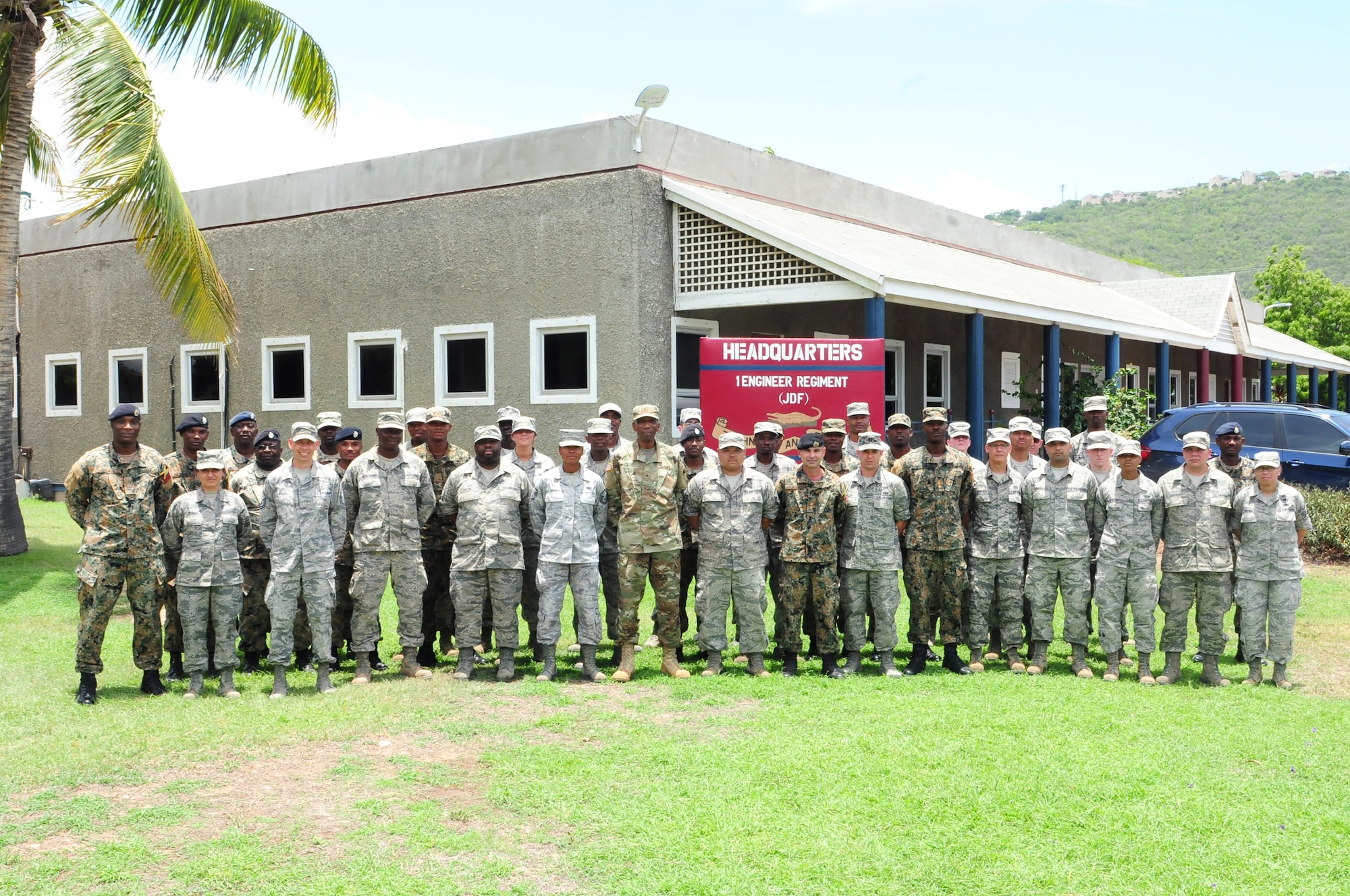 D.C. National Guard and Jamaica Defence Force 1 Engineer Regiment members pose together for a group photo on Up Camp Park Aug. 5. The 113th Civil Engineer Squadron members traveled to Jamaica as part of the State Partnership Program between the DCANG and JDF. (U.S. Air National Guard photo by Senior Airman Erica Rodriguez)