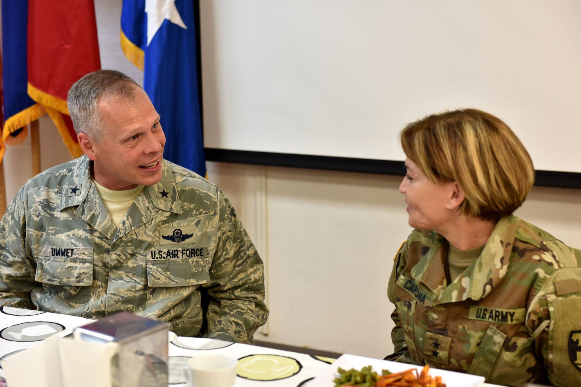 Maj. Gen. Marta Carcana, adjutant general for the Commonwealth of Puerto Rico, shares information with Brig. Gen. Wayne Zimmet, PR Air National Guard assistant adjutant general during a Lean In Circle luncheon at Muniz Air National Guard Base, Puerto Rico, August 13, 2016. The Las Bucaneras Lean In Circle is a group of military professionals from the 156th Airlift Wing whose mission is the provide women from the Puerto Rico Air National Guard a platform for mentorship and support through personal and professional development. (U.S. Air National Guard photo by Tech. Sgt. Efrain Sanchez)