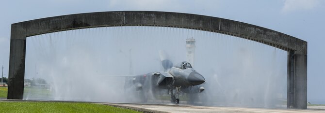 An F-15 Eagle goes through a birdbath Aug. 19, 2016, at Kadena Air Base, Japan. The birdbath is a vital component of maintaining the longevity of Kadena’s fighter aircraft. The birdbath prevents corrosion from building up on the aircraft. (U.S. Air Force photo by Airman 1st Class Lynette M. Rolen)