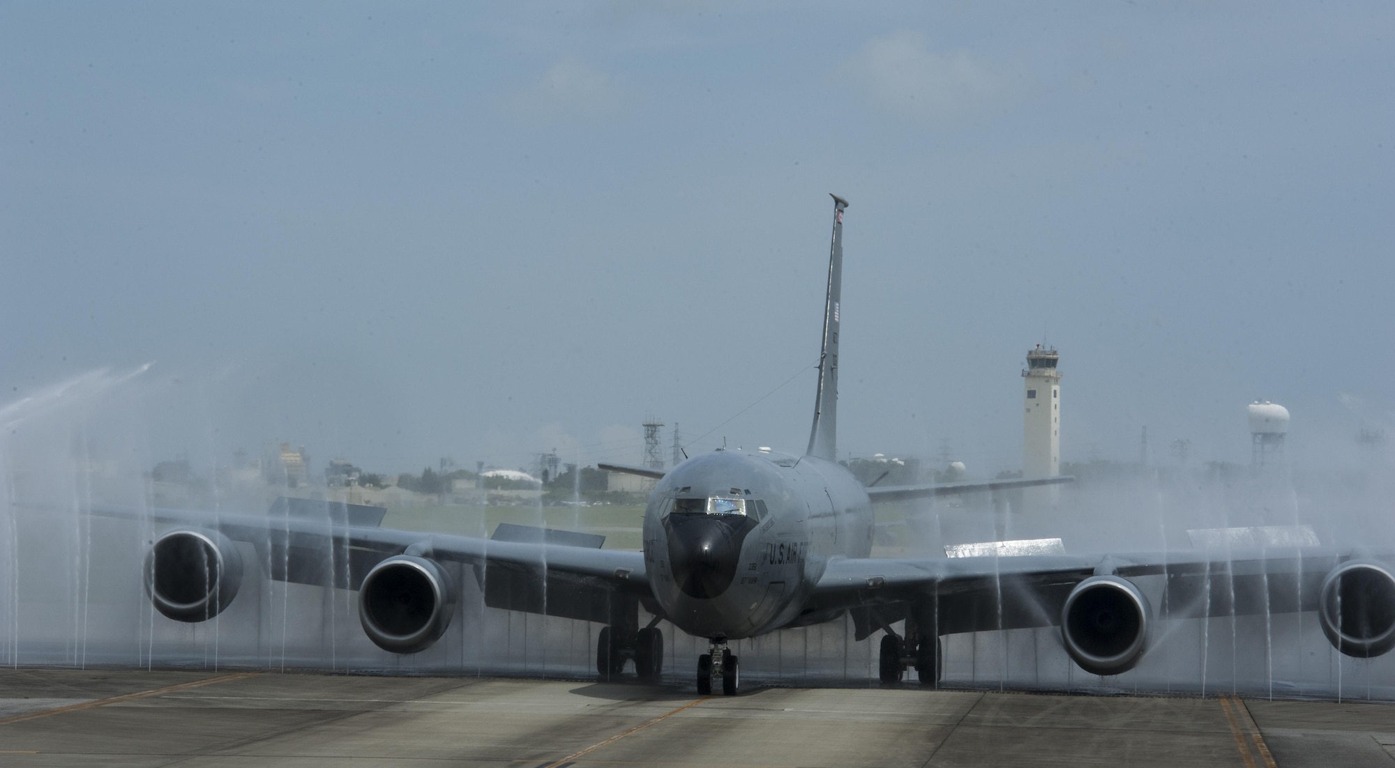 A KC-135 Stratotanker goes through a birdbath Aug. 22, 2016, at Kadena Air Base, Japan. The official name for the birdbath is the aircraft rinse system. The birdbath has a rinse time of 90 seconds, ensuring the aircraft is properly washed. (U.S. Air Force photo by Airman 1st Class Lynette M. Rolen)