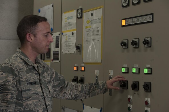 Senior Airman Jeffrey Kirkham, 18th Civil Engineer Squadron Water and Fuels System Maintenance (WFSM) journeyman, prepares to check one of the pumps of a birdbath Aug. 22, 2016, at Kadena Air Base, Japan. The 18th CES WFSM team checks the birdbath system for functionality. The team can turn off one of the pumps manually and check the others for efficiency. (U.S. Air Force photo by Airman 1st Class Lynette M. Rolen)