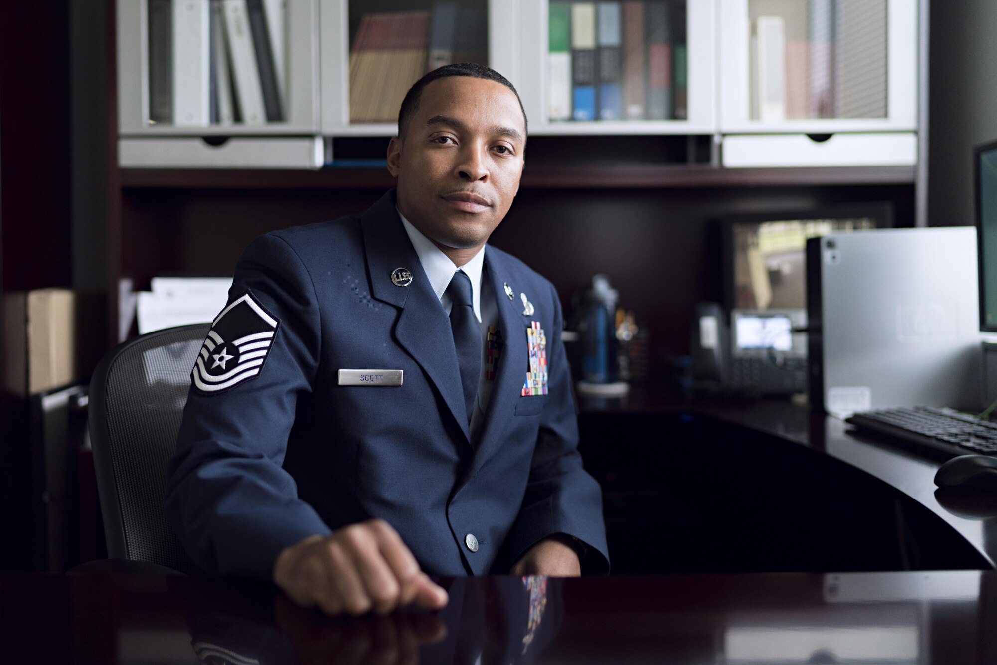 Master Sgt. Nicholas Scott, 374th Forces Support Squadron career assistance advisor, poses for a photo Aug. 15, 2016, at Yokota Air Base, Japan. As the career assistance advisor, Scott presents retraining opportunities, organizes professional enhancement seminars and provides informed decision briefings which help Airmen realize the benefits of continuing service to the military service. (U.S. Air Force photo by Senior Airman Delano Scott/Released) 