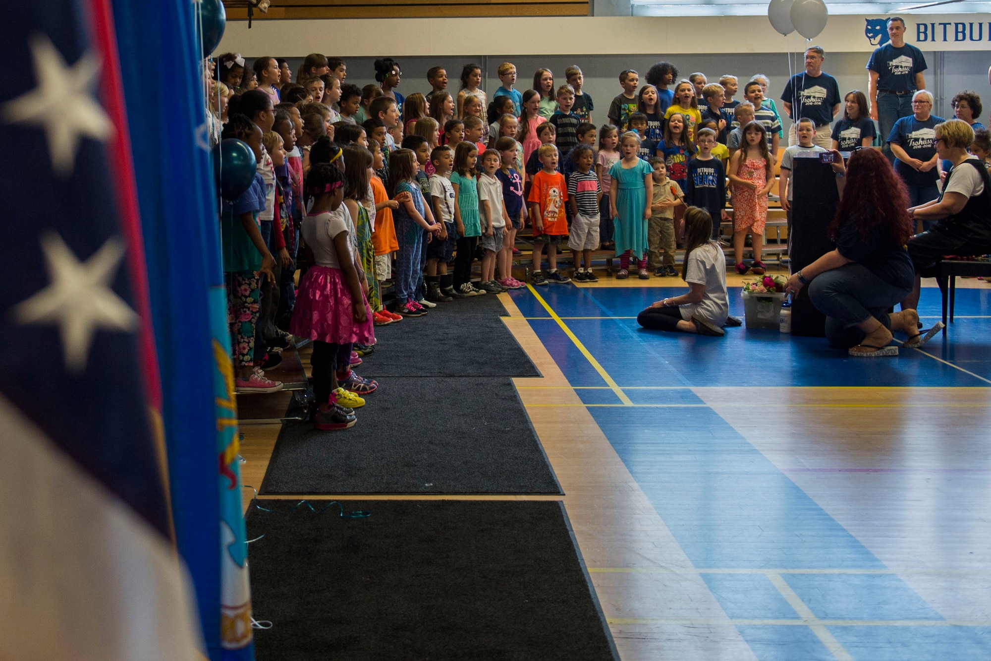 Bitburg Elementary School students sing in an assembly for the last day of the school's operations at Bitburg Annex, Germany, June 10, 2016. The 2016-2017 school year will be the first to feature a single elementary school for 52nd Fighter Wing students at Spangdahlem Air Base, Germany. (U.S. Air Force photo by Senior Airman Luke Kitterman/Released)