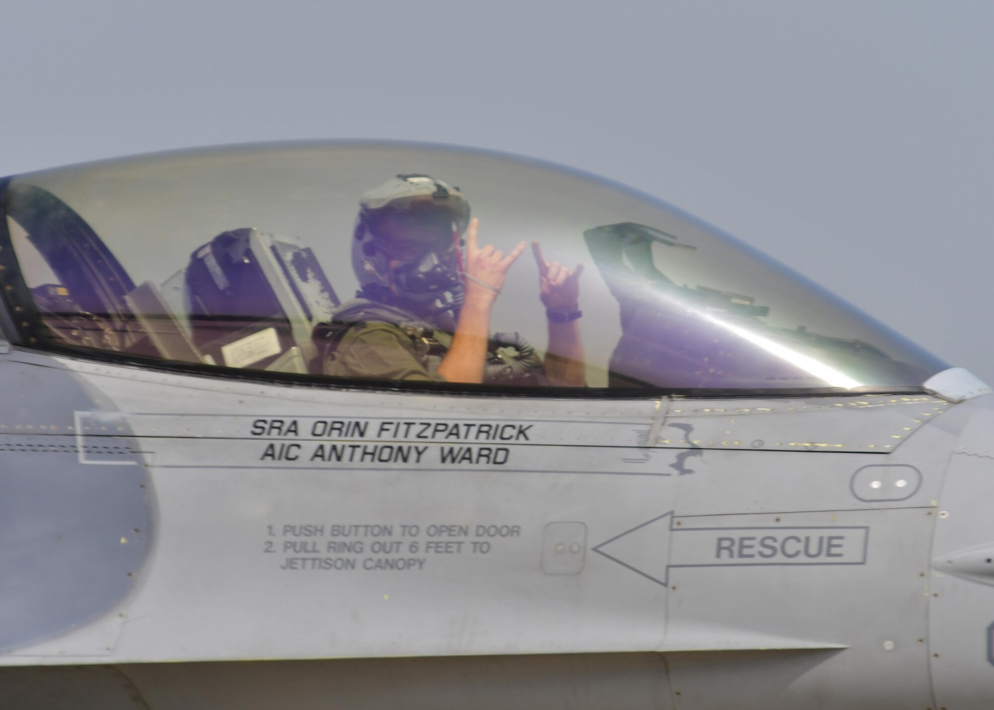 A 36th Fighter Squadron pilot shows his squadron hand-sign before a sortie flown in support of Exercise Beverly Herd 16-2 at Osan Air Base, Republic of Korea, Aug. 24, 2016. The 36th FS Fiends fly the F-16 Fighting Falcon and are one of the Air Force’s oldest units, having been activated in 1917 and continually operated since 1930. (U.S. Air Force photo by Senior Airman Victor J. Caputo)