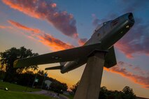 A U.S. Air Force F-86 Sabre fighter aircraft, formerly of the 53rd Fighter Squadron, remains on display in a traffic circle at Spangdahlem Air Base, Germany, Aug. 18, 2016. The aircraft serves as the basis for the term 'Saber Nation' used for the 52nd Fighter Wing and Spangdahlem Air Base. (U.S. Air Force photo by Staff Sgt. Joe W. McFadden/Released)