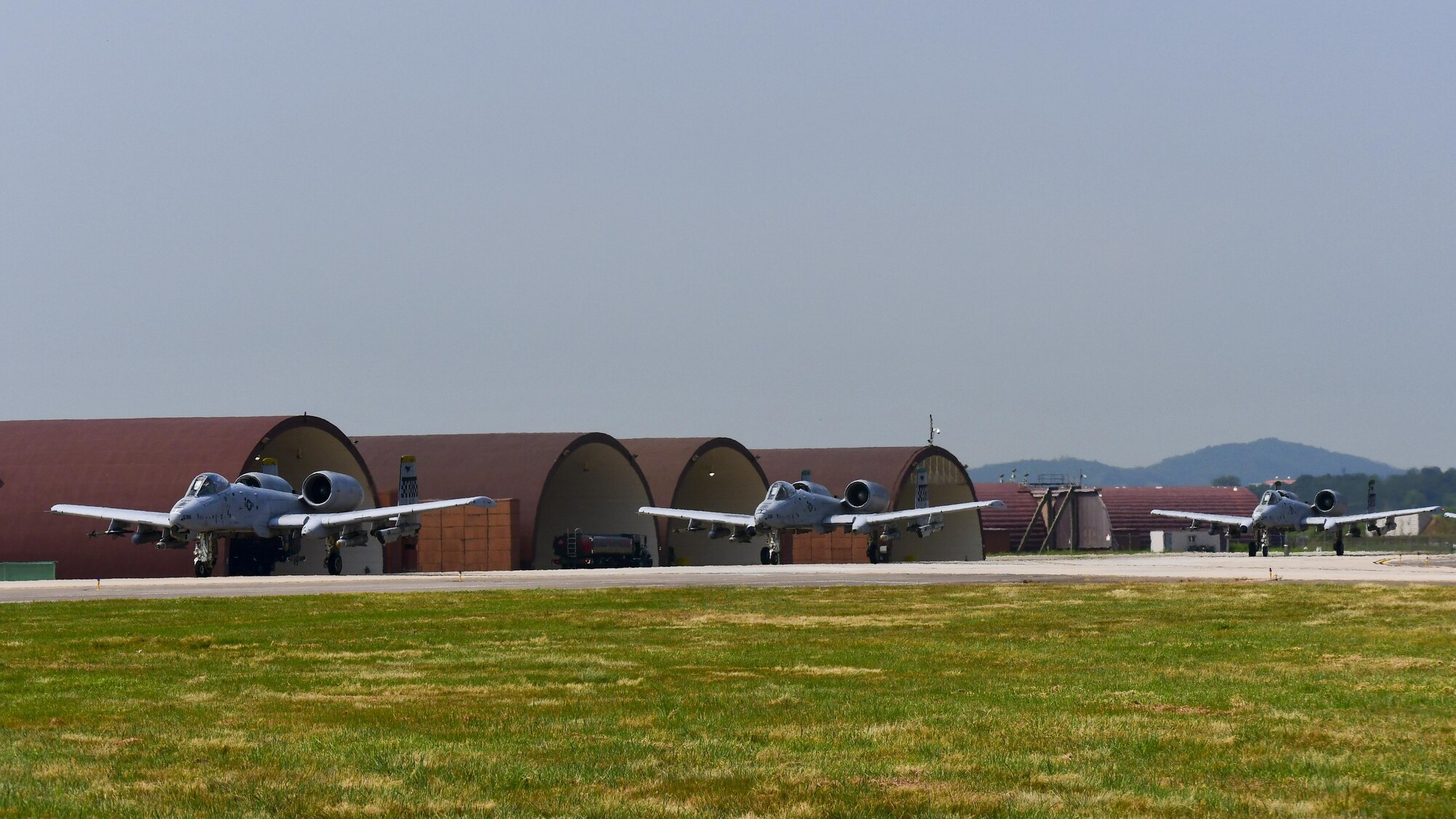 Three A-10 Thunderbolt IIs, assigned to the 25th Fighter Squadron, taxi out to the runway before a sortie flown in support of Exercise Beverly Herd 16-2 at Osan Air Base, Republic of Korea, Aug. 24, 2016. The A-10 is the Air Force’s premiere close air support airframe and a vital part of the 51st Fighter Wing’s mission to be able to “Fight Tonight.” (U.S. Air Force photo by Senior Airman Victor J. Caputo)