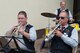Members of the 52nd Fighter Wing Base Brass Band, Erich Kremer, left front, and Thomas Pitsch, right front, play trumpets, while Herbert Lehnertz beats a set of drums during a musical performance at Multicultural Awareness Day Aug. 18, 2016, at Club Eifel, Spangdahlem Air Base, Germany. Multicultural Awareness Day provided Spangdahlem members and their families a variety of free, culturally-diverse entertainment including a band, singing, dancing and a fashion show. (U.S. Air Force photo by Tech. Sgt. Amanda Currier)  