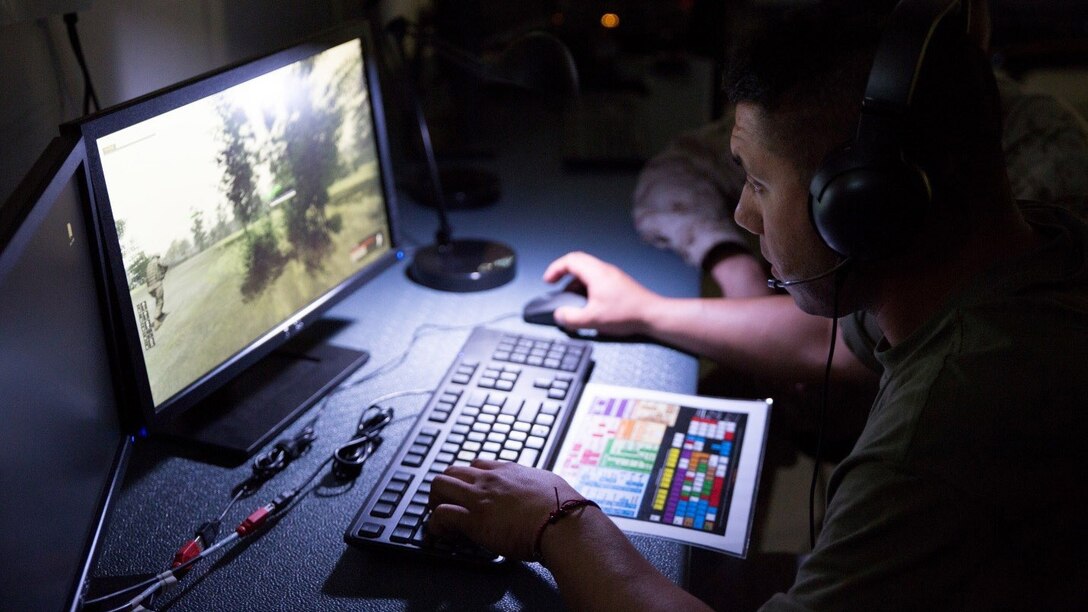 Sgt. Sergio E. Sotelo, a motor transport operator with 4th Medical Battalion, 4th Marine Logistics Group, Marine Forces Reserve, leads his Marines on a virtual patrol mission during Exercise Global Medic at Fort McCoy, Wisconsin, August 18, 2016. Using the equipment, Marines were able to see and hear the virtual environment with members of their squad, make contact with enemy forces, clear rooms and patrol through the rally point at the end of the course. 