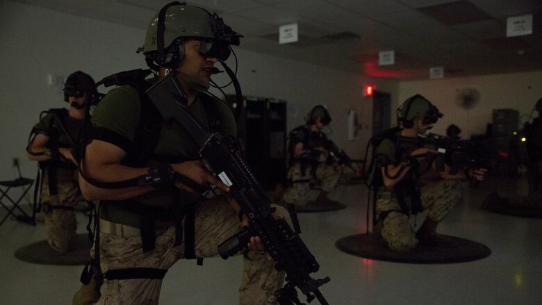 Motor Transport Marines with 4th Medical Battalion, 4th Marine Logistics Group, Marine Forces Reserve, train on a virtual patrol mission during Exercise Global Medic at Fort McCoy, Wisconsin, August 18, 2016. Using the equipment, Marines were able to see and hear the virtual environment with members of their squad, make contact with enemy forces, clear rooms and patrol through the rally point at the end of the course. 