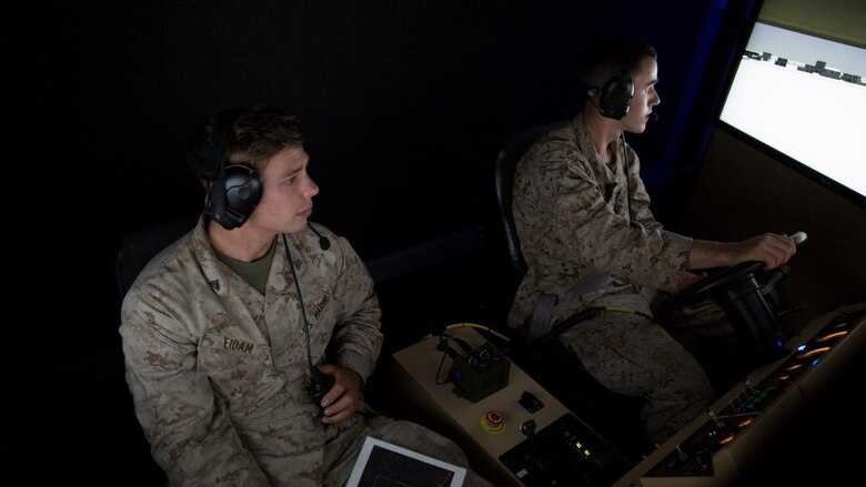 Cpl. Paul J. Eidam and Lance Cpl. Ryan A. Meredith, motor transport operators with 4th Medical Battalion, 4th Marine Logistics Group, Marine Forces Reserve, train in a virtual reality convoy simulator during Exercise Global Medic at Fort McCoy, Wisconsin, August 17, 2016. The Marines were able to embark on a virtual convoy where they had to problem solve with issues that occurred along the way and safely make it to the rally point at the end of the route. 