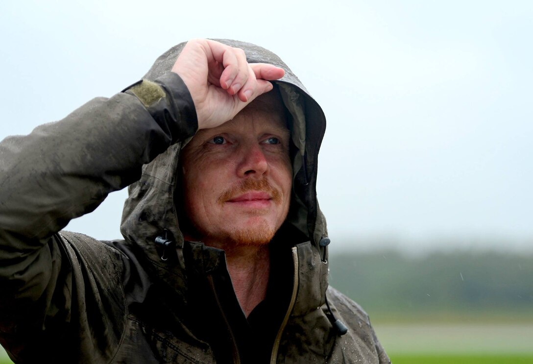 Patrick van Dam, a Dutch freelance photographer and graphic designer, stands on the flightline at Ämari Air Base, Estonia, Aug. 17, 2016. Van Dam has been designing and producing patches for the squadron for 15 years, and has created approximately 25 patch designs. (U.S. Air Force photo by Senior Airman Erin Trower/Released)
